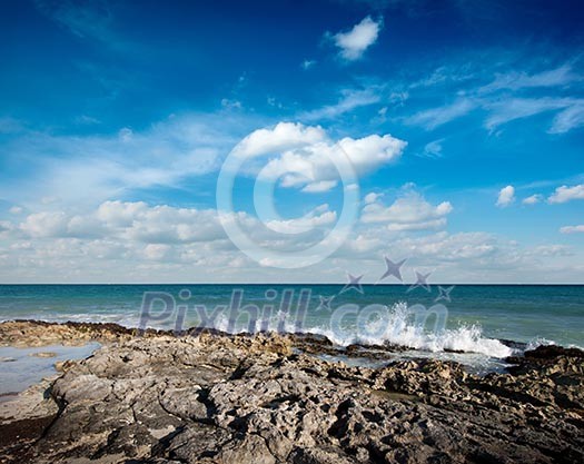 Waves breaking againt rocky coast