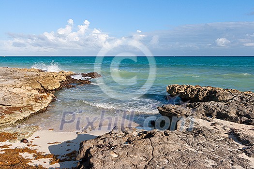 Waves breaking againt rocky coast Waves breaking againt rocky coast