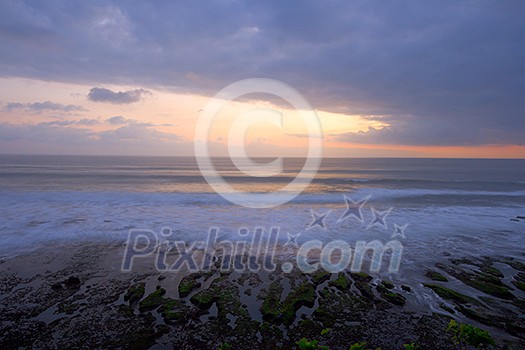 Calm ocean during tropical sunrise Calm ocean during tropical sunrise