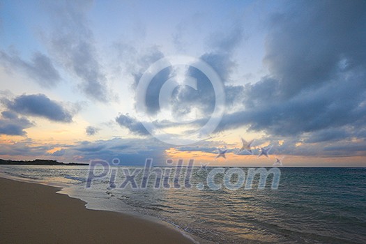 Calm ocean and beach on tropical sunrise Calm ocean and beach on tropical sunrise