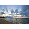 Calm ocean and beach on tropical sunrise