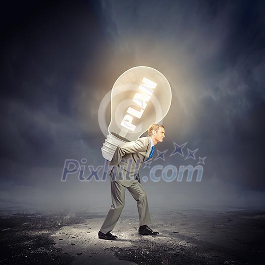 Image of businessman carrying bulb on back. New idea Image of businessman carrying bulb on back. New idea