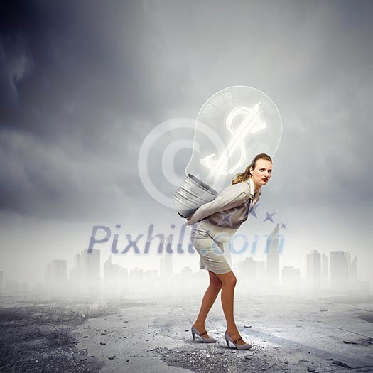 Image of businesswoman holding bulb on back Image of businesswoman holding bulb on back