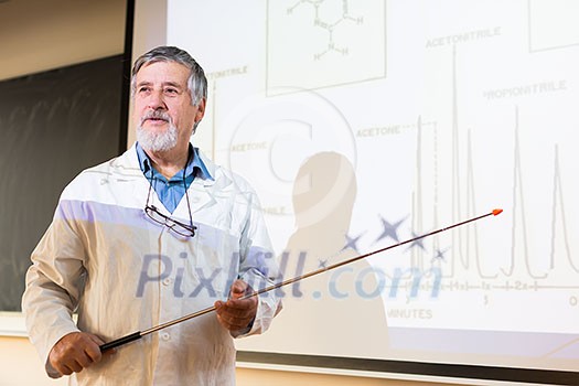 Senior chemistry professor giving a lecture in front of classroom full of students (shallow DOF; color toned image) Senior chemistry professor giving a lecture in front of classroom full of students (shallow DOF; color toned image)