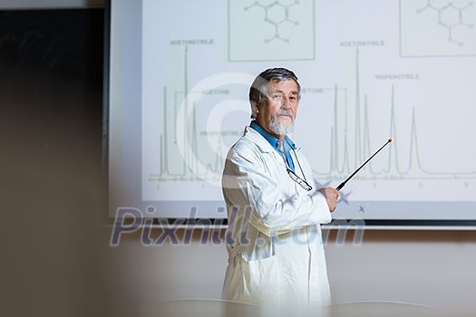 Senior chemistry professor giving a lecture in front of classroom full of students (shallow DOF; color toned image) Senior chemistry professor giving a lecture in front of classroom full of students (shallow DOF; color toned image)