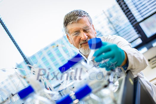 Senior male researcher carrying out scientific research in a lab (shallow DOF; color toned image)