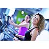 group of young people running on treadmills in modern sport  gym