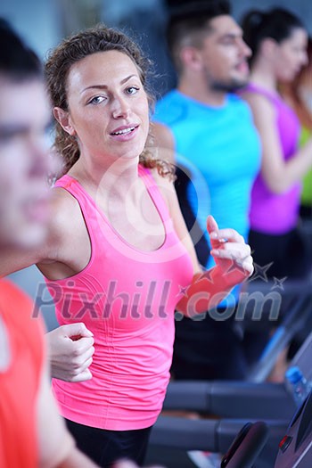 sport, fitness, lifestyle, technology and people concept - smiling woman exercising on treadmill in gym