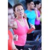 sport, fitness, lifestyle, technology and people concept - smiling woman exercising on treadmill in gym