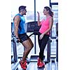 attractive couple at the gym looking happy