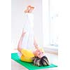 Pretty young woman doing YOGA exercise at home