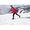 Cross-country skiing: young man cross-country skiing on a lovely sunny winter day