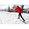 Cross-country skiing: young man cross-country skiing on a lovely sunny winter day