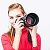 Pretty, female photographer with her digital camera (color toned image; shallow DOF)