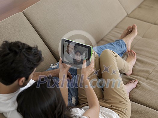 cheerful happy young couple making selfie together at home cheerful happy young couple making selfie together at home