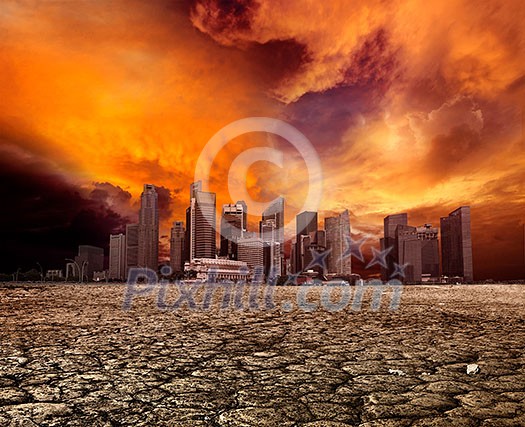 City overlooking desolate desert landscape with cracked earth City overlooking desolate desert landscape with cracked earth