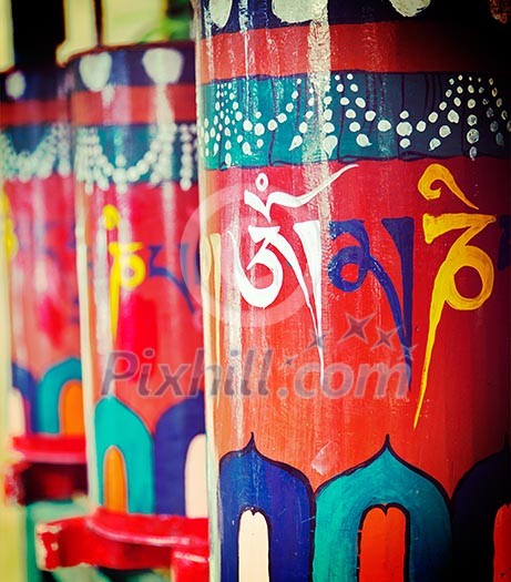 Vintage retro effect filtered hipster style travel image of Buddhist prayer wheels. Tsuglagkhang complex in McLeod Ganj, Himachal Pradesh, India Vintage retro effect filtered hipster style travel image of Buddhist prayer wheels. Tsuglagkhang complex in McLeod Ganj, Himachal Pradesh, India