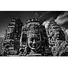 Ancient stone faces of Bayon temple, Angkor, Cambodia. Black and white version
