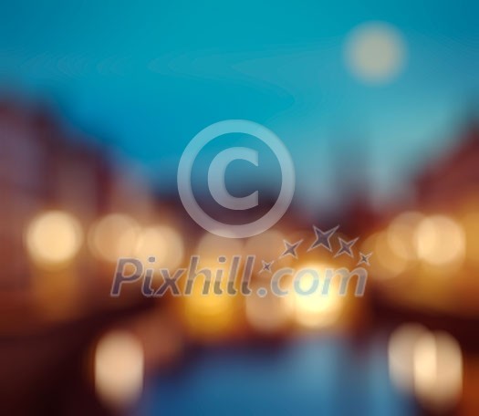Defocused blurred background of European city Bruges Brugge, Belgium in evening