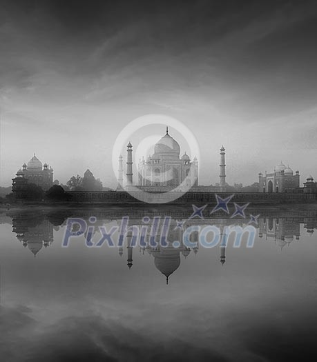 Taj Mahal with reflection in Yamuna river in fog, Indian Symbol - India travel background. Agra, Uttar Pradesh, India. Black and white version