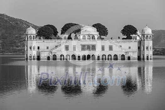 Rajasthan landmark - Jal Mahal Water Palace on Man Sagar Lake on sunset.  Jaipur, Rajasthan, India. Black and white version