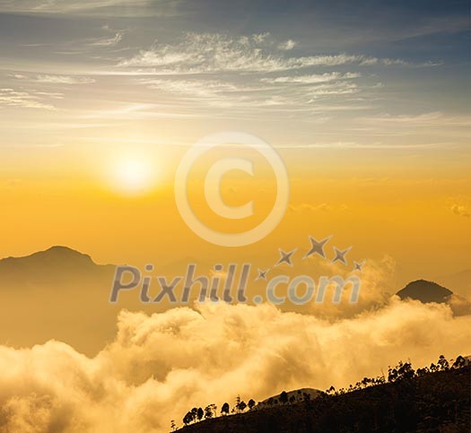 Mountains in clouds on sunrise. Kodaikanal, Tamil Nadu Mountains in clouds on sunrise. Kodaikanal, Tamil Nadu