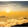 Mountains in clouds on sunrise. Kodaikanal, Tamil Nadu