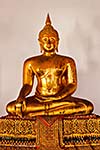 Sitting Buddha Gold Statue close up in Buddhist Temple. Wat Pho, Bangkok, Thailand