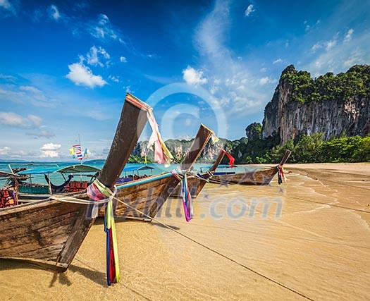 Long tail boats on tropical beach Railay beach in Thailand Long tail boats on tropical beach Railay beach in Thailand