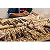 Carver in wood working in workshop, India