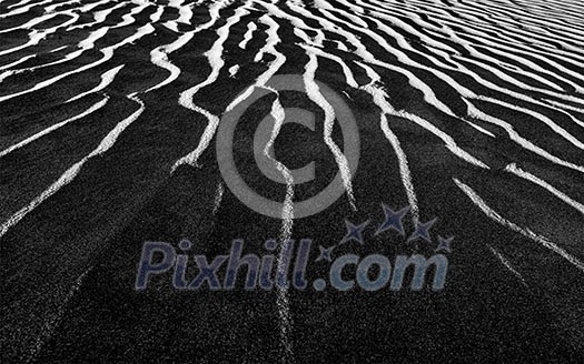 Shadow and light dunes sand close up on sunrise. Black and white version Shadow and light dunes sand close up on sunrise. Black and white version