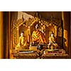 Buddha statues in Burma famous sacred place and tourist attraction landmark - Shwedagon Paya pagoda. Yangon, Myanmar