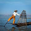 Myanmar travel attraction landmark - Traditional Burmese fisherman at Inle lake, Myanmar famous for their distinctive one legged rowing style