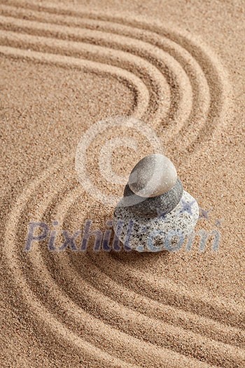 Japanese Zen stone garden - relaxation, meditation, simplicity and balance concept  - pebbles and raked sand tranquil calm scene
