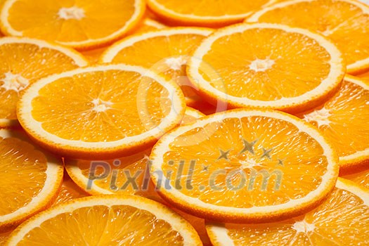 Colorful orange citrus fruit slices background Colorful orange citrus fruit slices background