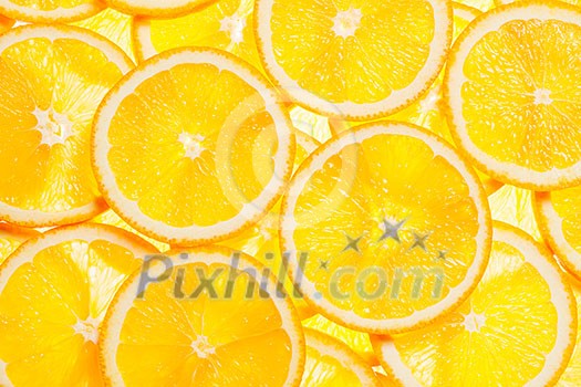 Colorful orange citrus fruit slices background backlit Colorful orange citrus fruit slices background backlit