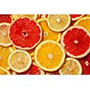 Colorful citrus fruit - lemon, orange, grapefruit - slices background