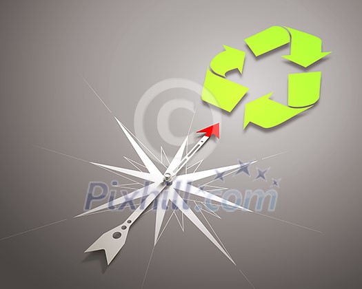 Conceptual image of compass pointing at recycle symbol Conceptual image of compass pointing at recycle symbol