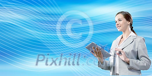 Attractive smiling businesswoman holding tablet pc in hands Attractive smiling businesswoman holding tablet pc in hands