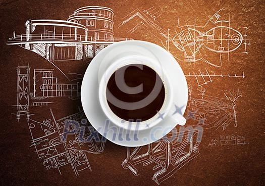 Close up of cup of coffee on table with sketches on background Close up of cup of coffee on table with sketches on background