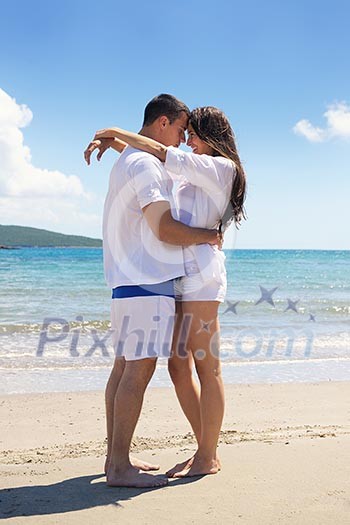 happy young couple have fun and relax on the beach happy young couple have fun and relax on the beach