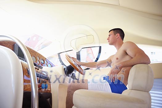 young happy man have fun on luxury boat yacht young happy man have fun on luxury boat yacht