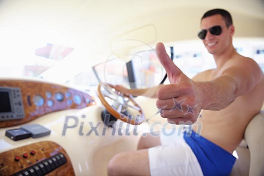 young happy man have fun on luxury boat yacht young happy man have fun on luxury boat yacht