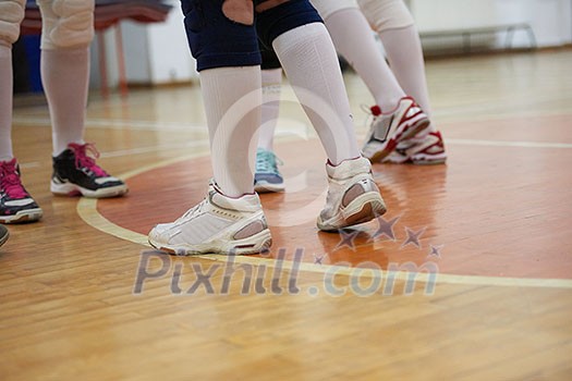 volleyball game sport with group of young beautiful girls indoor in sport arena school gym
