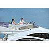 Romantic young couple spending time together and relaxing on yacht