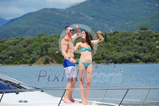 Romantic young couple spending time together and relaxing on yacht Romantic young couple spending time together and relaxing on yacht