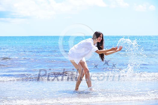 beautifel and happy woman girl on beach have fun and relax on summer vacation over the beautiful tropical sea beautifel and happy woman girl on beach have fun and relax on summer vacation over the beautiful tropical sea