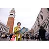 Beautiful tourist woman in Venice, exploring the old city