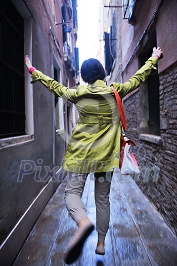 Beautiful tourist woman in Venice, exploring the old city Beautiful tourist woman in Venice, exploring the old city