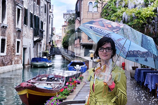 Beautiful tourist woman in Venice, exploring the old city Beautiful tourist woman in Venice, exploring the old city